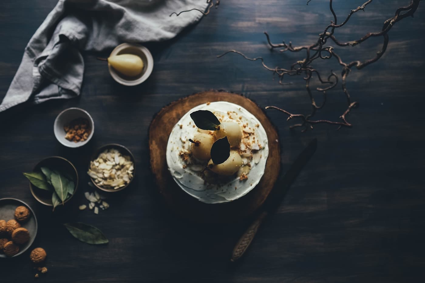 A dark, quietly lit dessert on a handmade ceramic plate