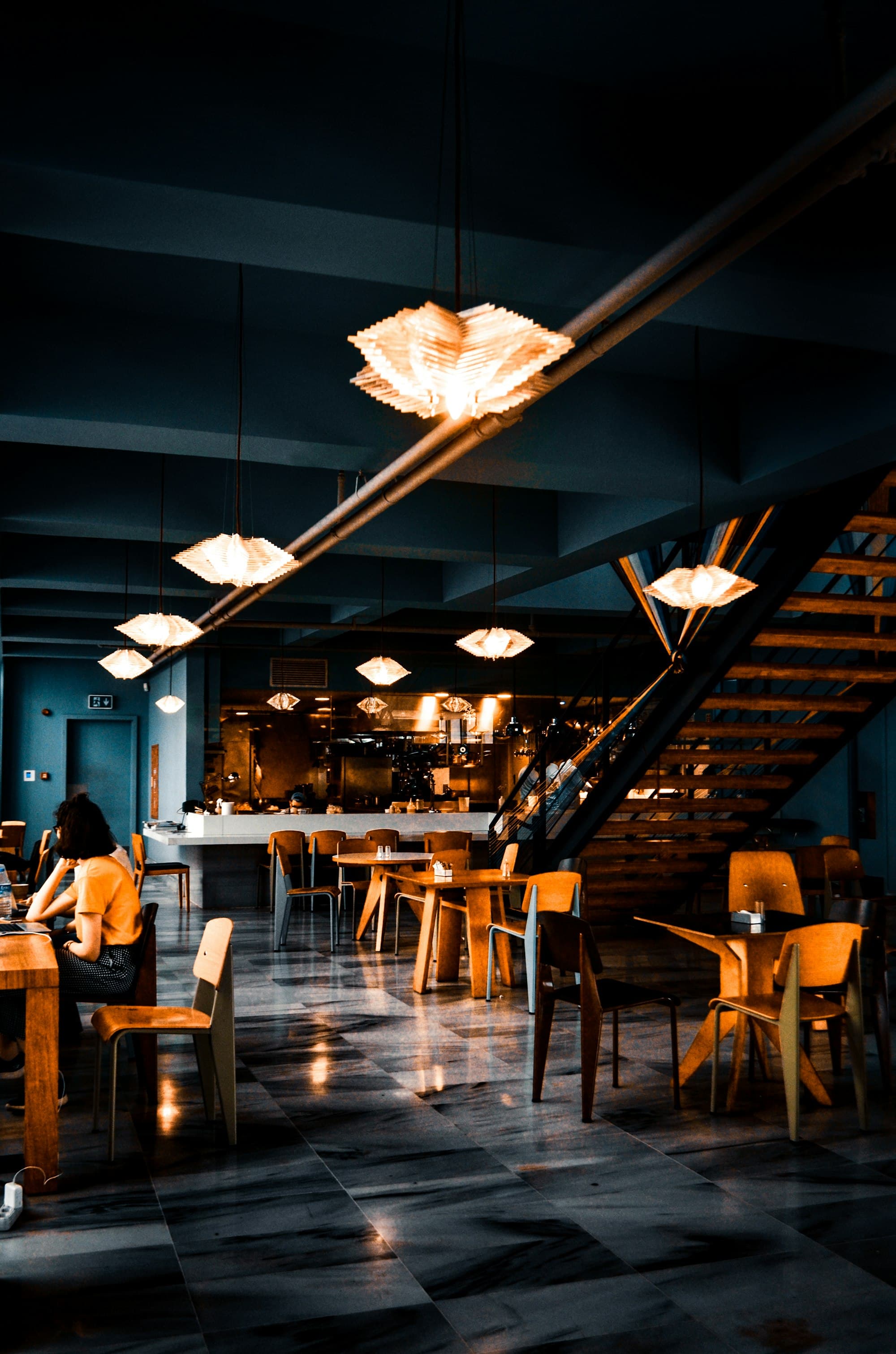 The dining room at Morrow & Bean in the evening under low pendant lighting