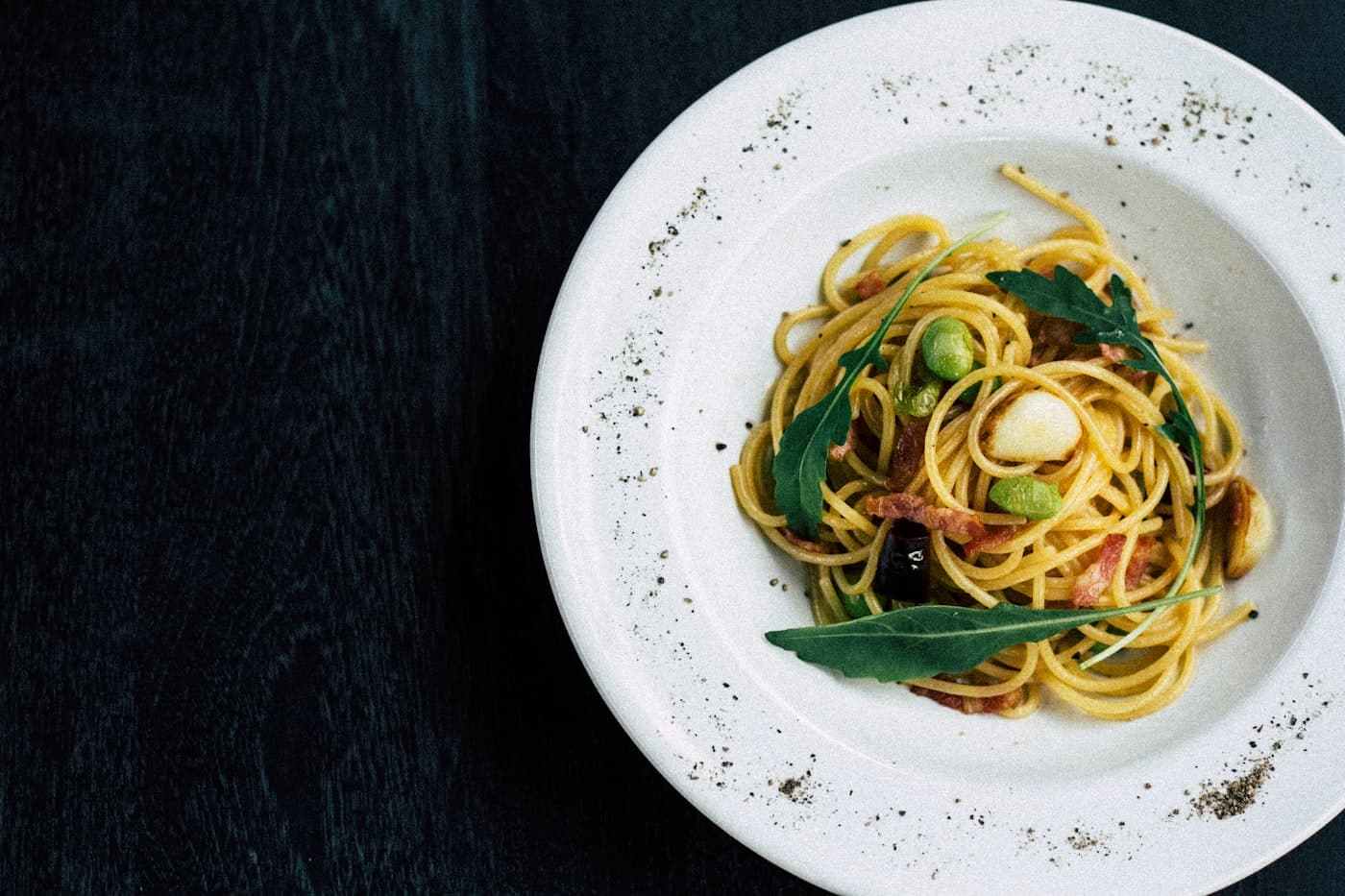 Wild mushroom pasta twirled on a white plate